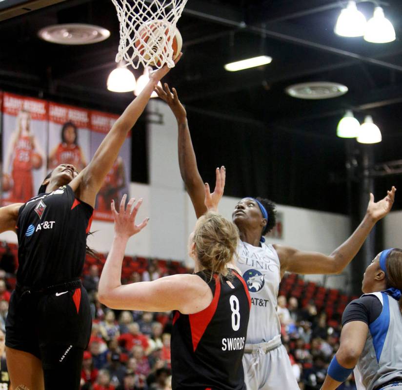 Las Vegas Aces A'ja Wilson (22) tries for a basket against Minnesota Lynx Sylvia Fowles (34) at ...