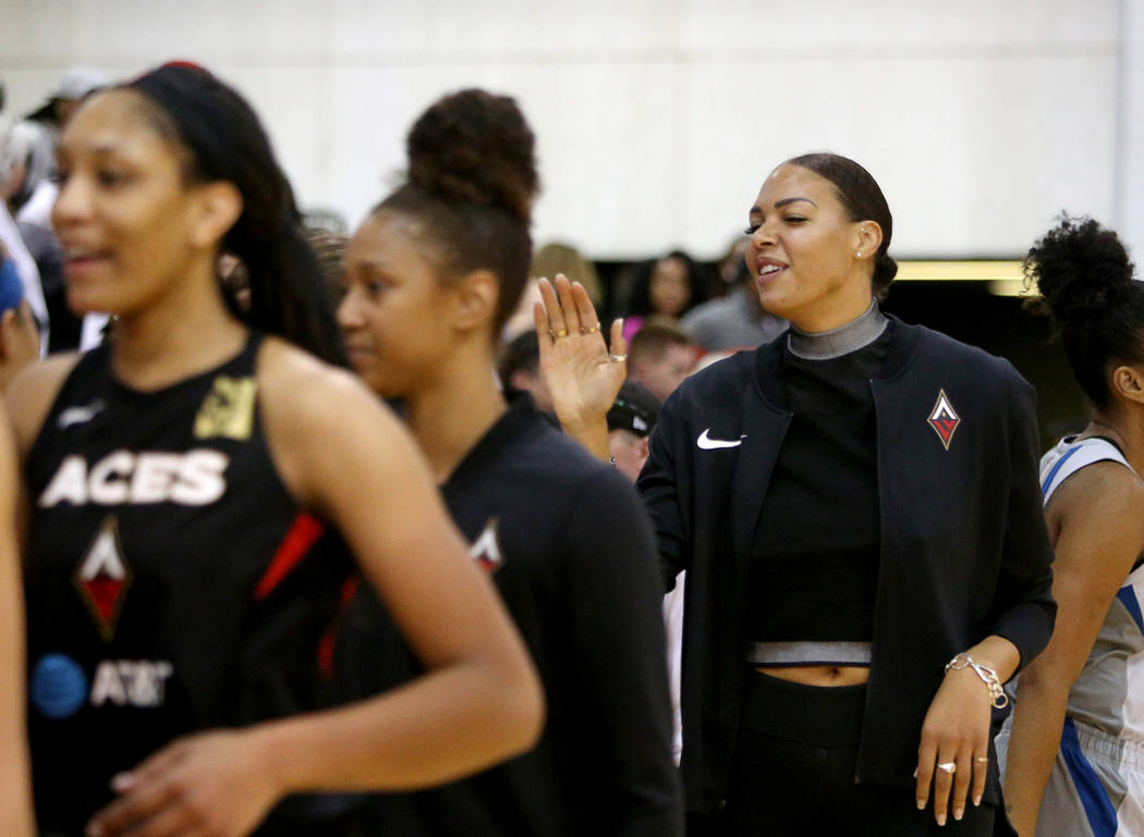 Liz Cambage, who was recently traded to the Aces from the Dallas Wings, high-fives teammates an ...