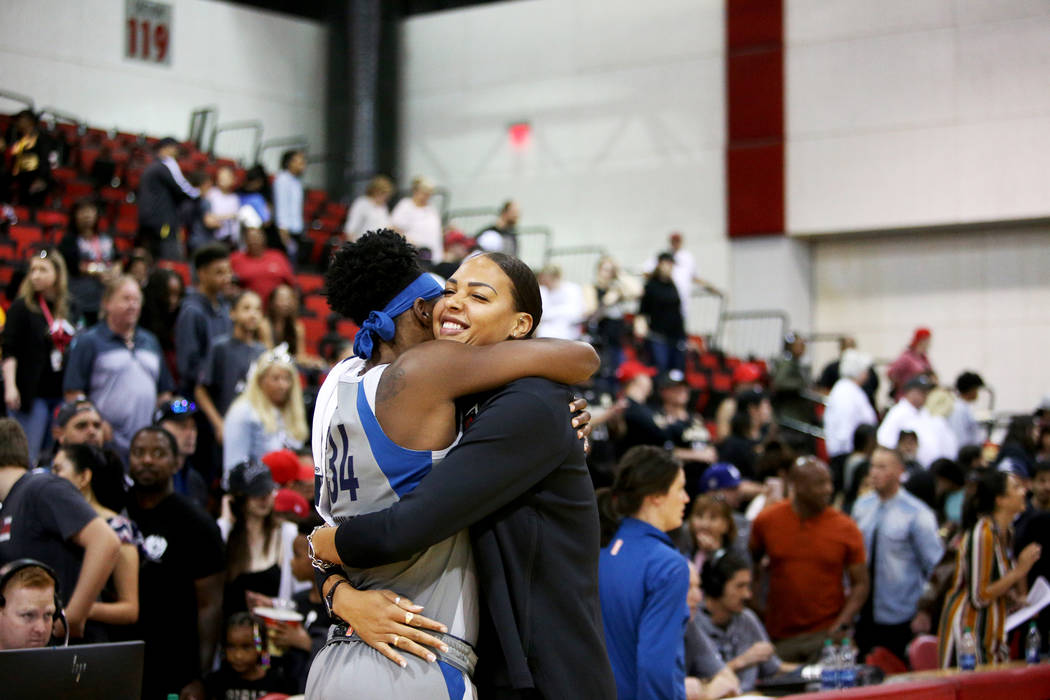 Liz Cambage, who was recently traded to the Aces from the Dallas Wings, hugs Minnesota Lynx Syl ...
