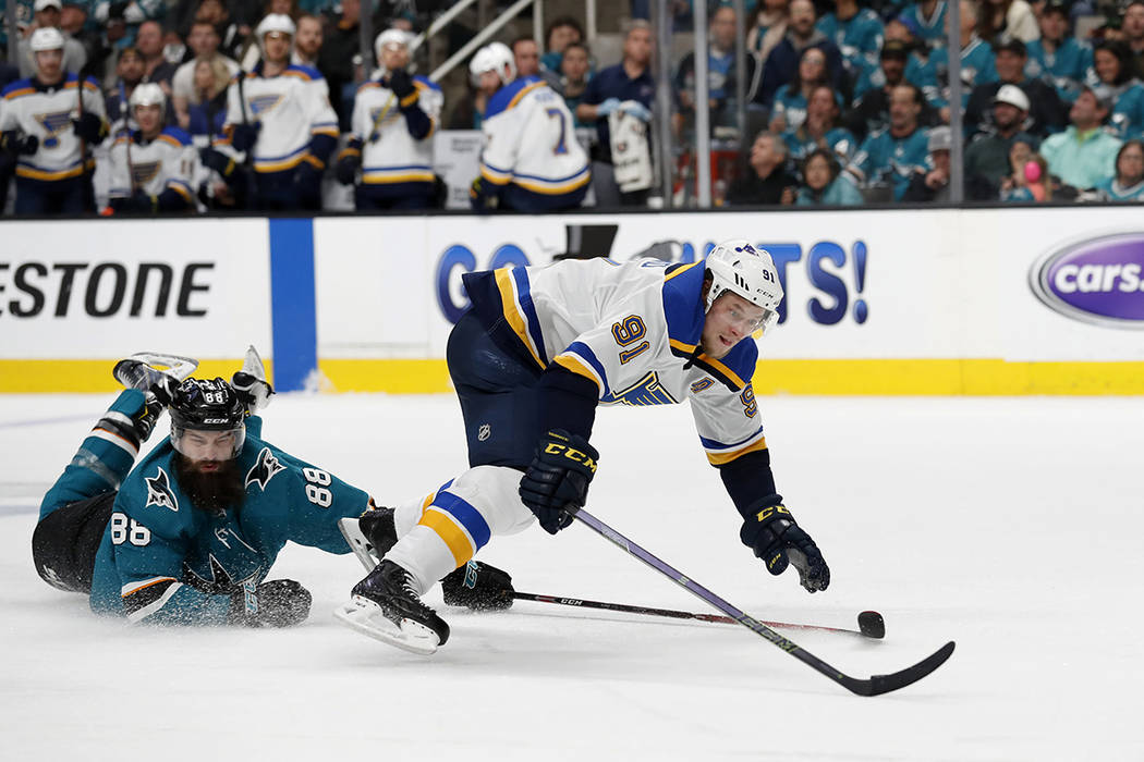 San Jose Sharks' Brent Burns (88) interferes on a breakaway of St. Louis Blues' Vladimir Tarase ...