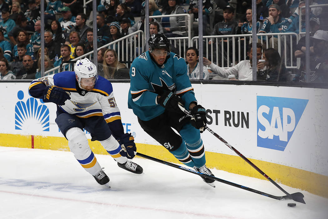 St. Louis Blues' Colton Parayko (55) battles for the puck against San Jose Sharks' Evander Kane ...