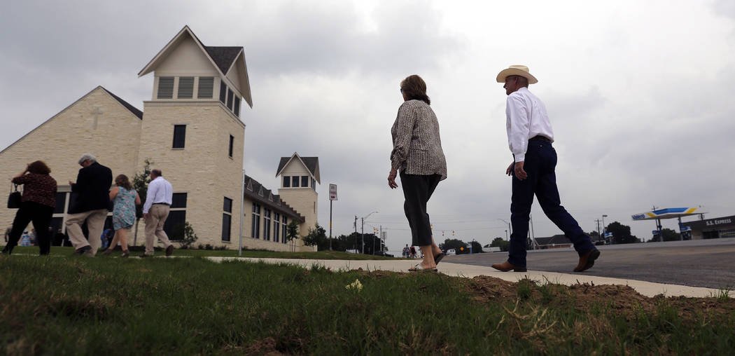 Churchgoers arrive for a dedication ceremony for a new sanctuary and memorial room at the First ...