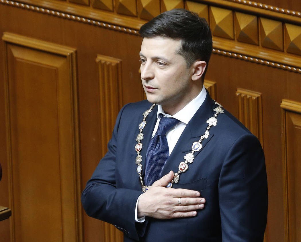 Ukrainian President-elect Volodymyr Zelenskiy sings the national anthem during his inauguration ...