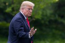 President Donald Trump waves after stepping off Marine One on the South Lawn of the White House ...