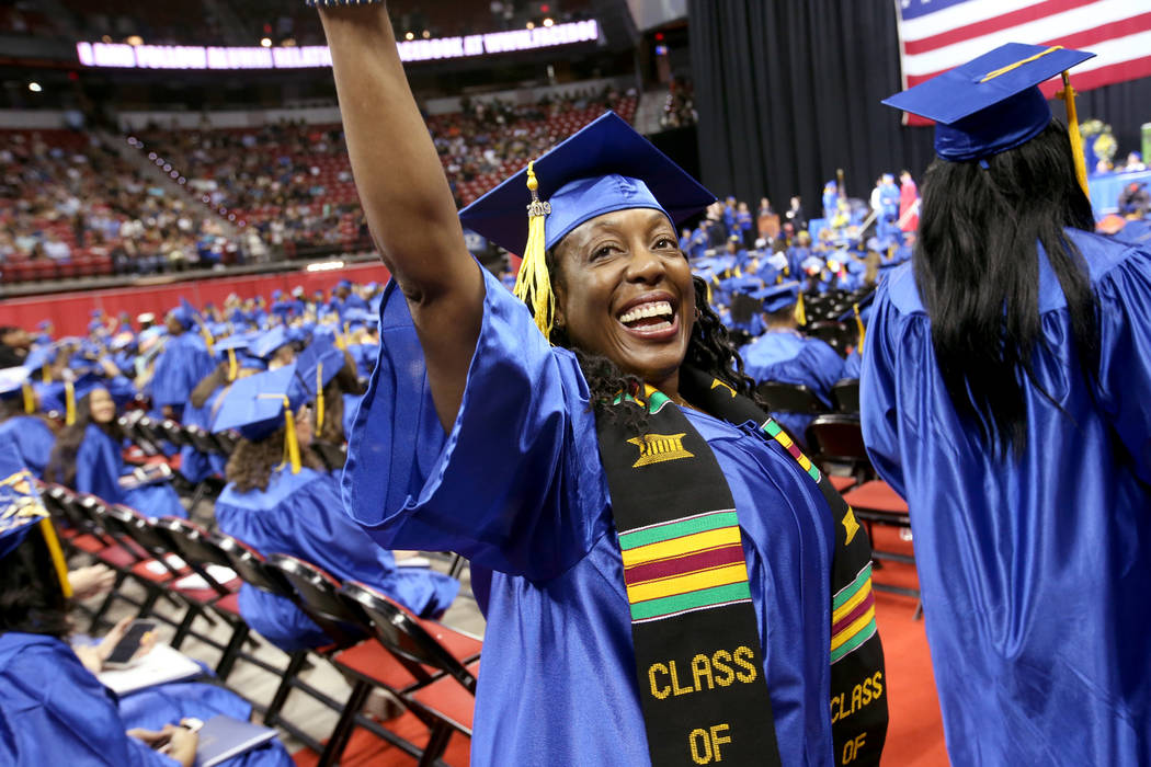 Victoria Lopez waves to her family during College of Southern Nevada commencement ceremony at T ...