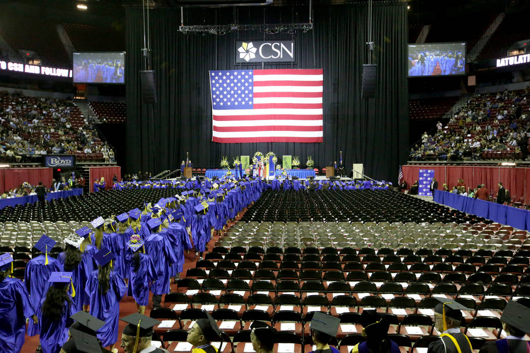 Graduates walk in the processional during College of Southern Nevada commencement ceremony at T ...