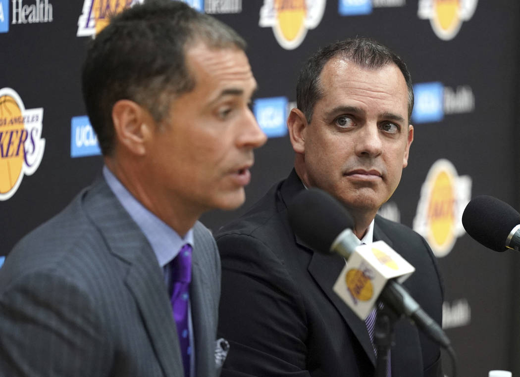 Los Angeles Lakers NBA basketball team general manager Rob Pelinka, left, introduces Frank Voge ...