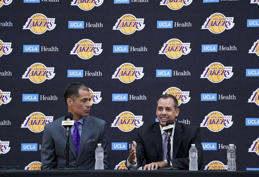 Los Angeles Lakers NBA basketball team general manager Rob Pelinka, left, introduces Frank Voge ...