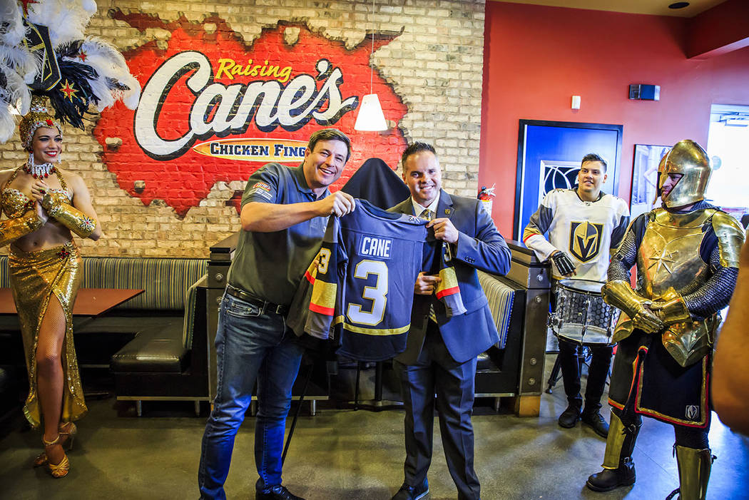 Raising Cane's founder Todd Graves, left, and Golden Knights Chief Marketing Officer Brian Kill ...