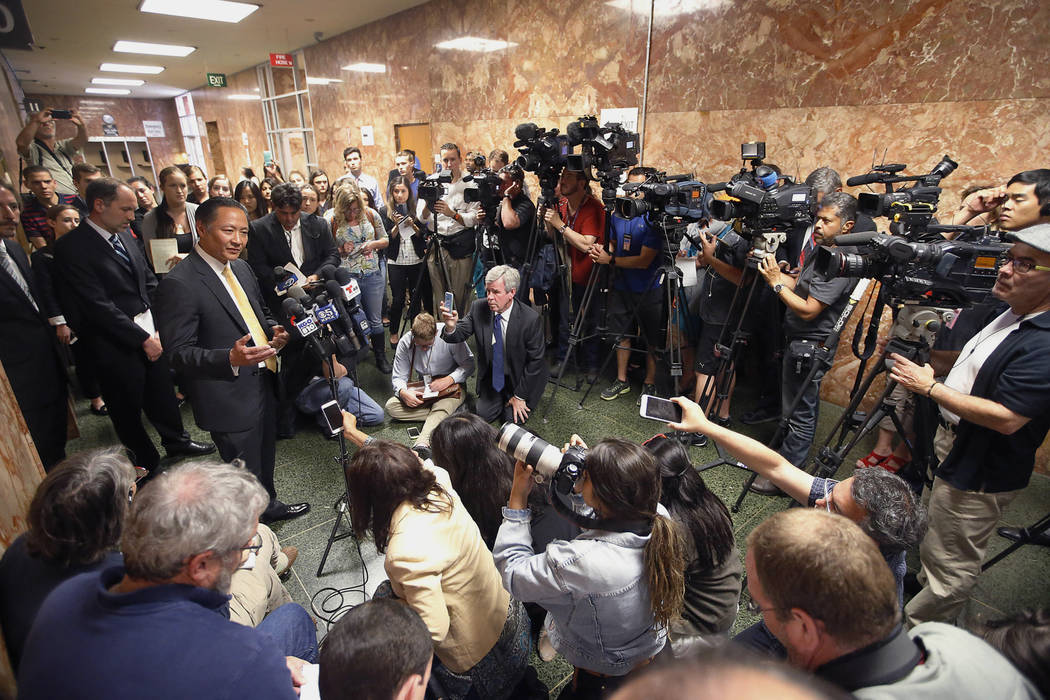 In this July 7, 2015, file photo, San Francisco Public Defender Jeff Adachi, left, talks to mem ...