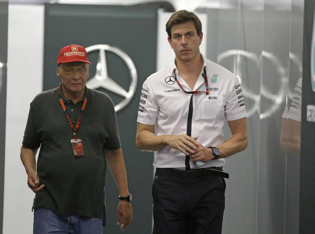 In this Saturday, Sept. 19, 2015 file photo Head of Mercedes-benz Motorsports Toto Wolff, right ...