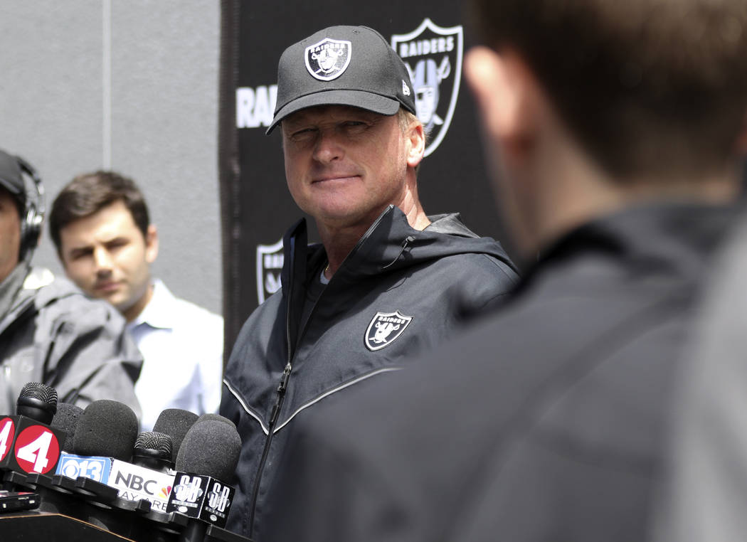 Oakland Raiders head coach Jon Gruden listens to media questions after an offseason training se ...