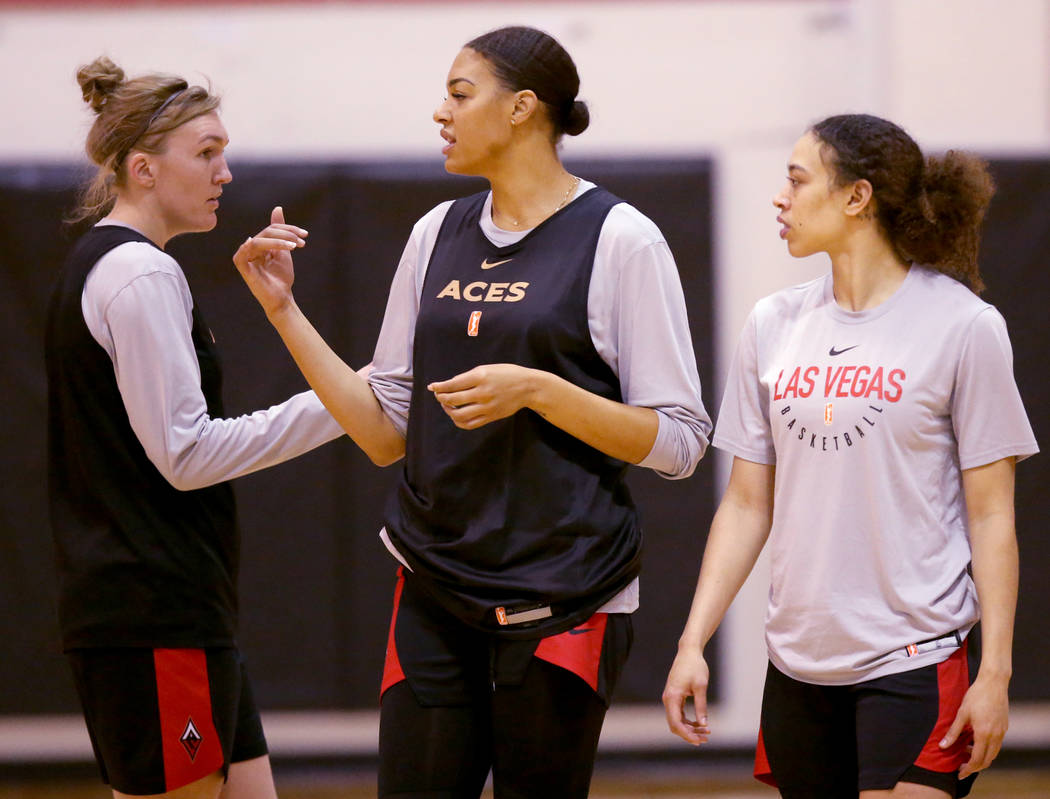 Aces center Liz Cambage, center, with Carolyn Swords, left, and Dearica Hamby during practice a ...