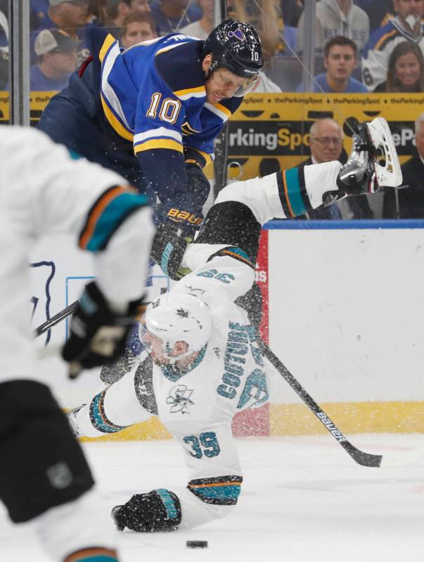 St. Louis Blues center Brayden Schenn (10) collides with San Jose Sharks center Logan Couture ( ...