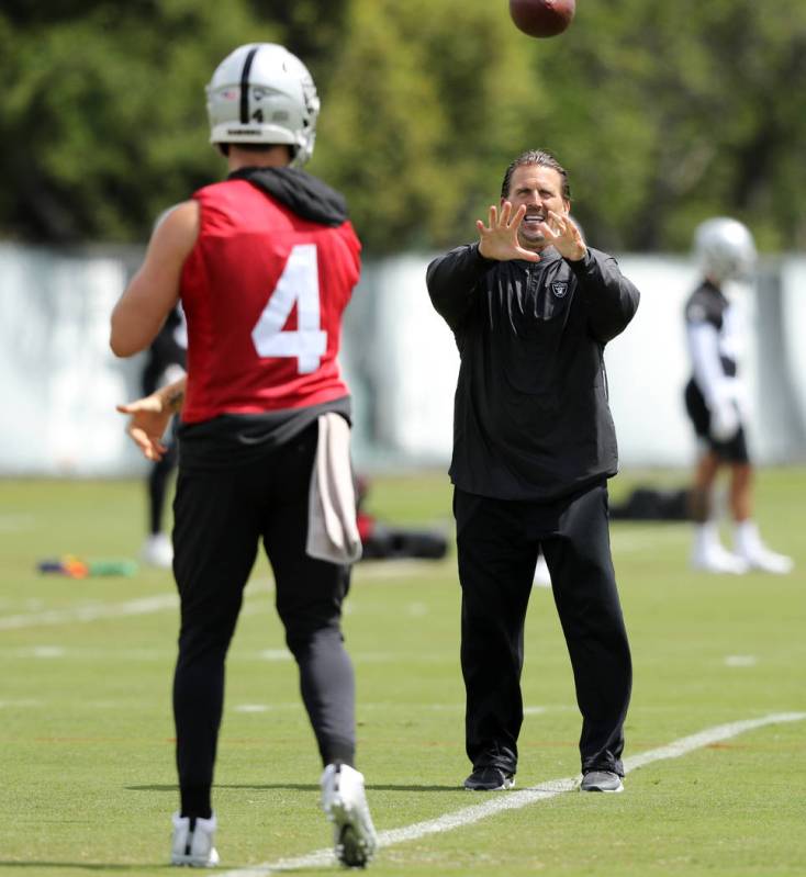 Oakland Raiders quarterback Derek Carr (4) throws the football to offensive coordinator Greg Ol ...