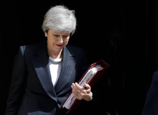 Britain's Prime Minister Theresa May leaves 10 Downing Street to attend the weekly session of P ...
