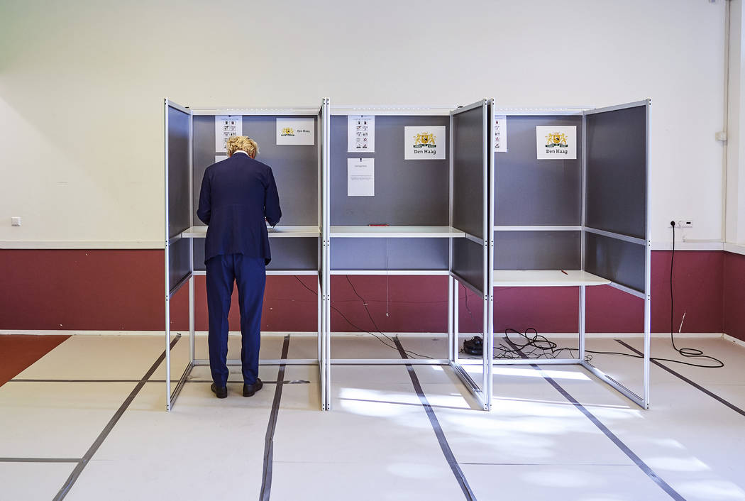 Geert Wilders, leader of the Dutch Party for Freedom, casts his ballot in the European election ...