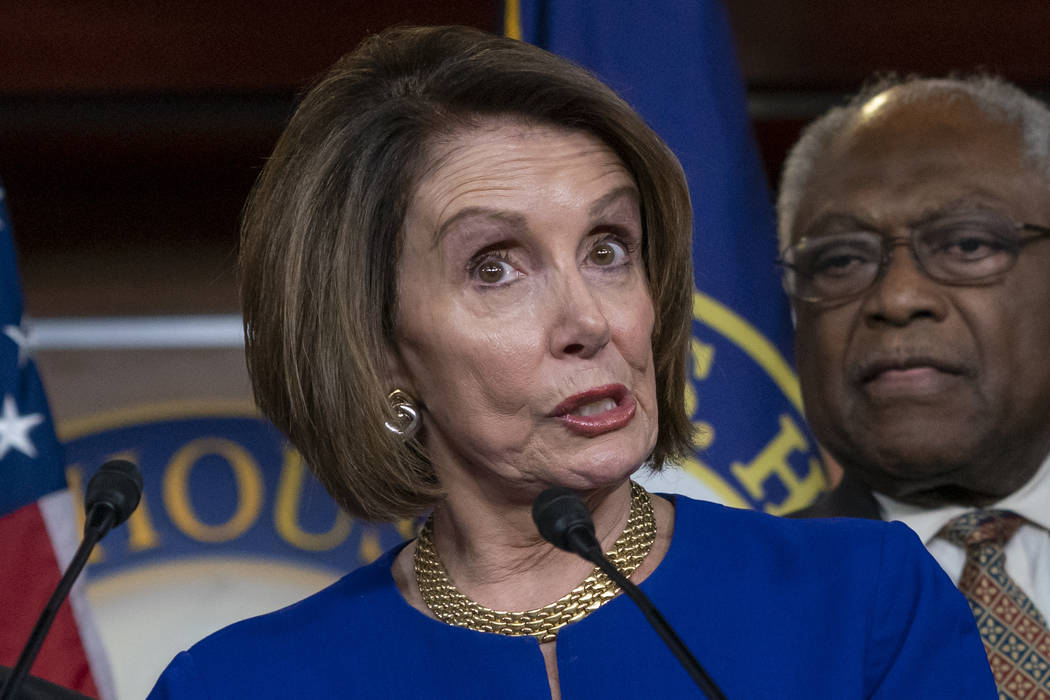 Speaker of the House Nancy Pelosi, D-Calif., joined at right by Majority Whip James E. Clyburn, ...