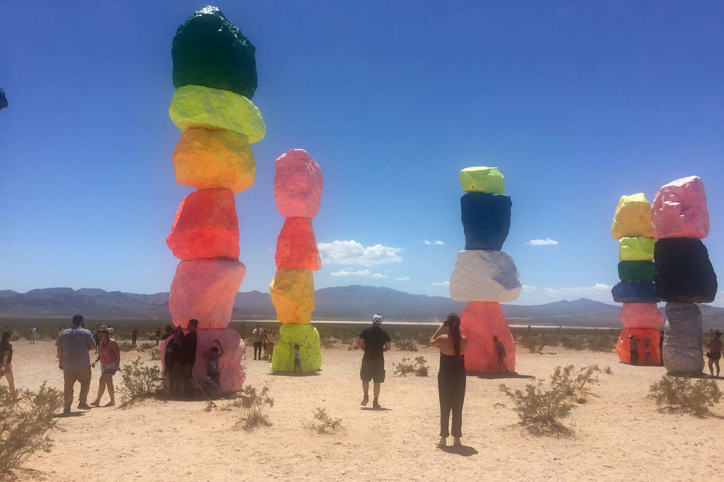 People visit the " Seven Magic Mountains, " art installation located near Jean Dry Lake Bed an ...