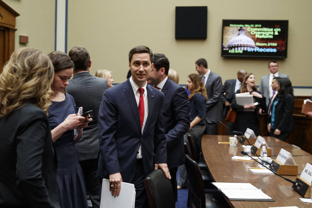 Twitter Public Policy Manager Kevin Kane walks from the hearing room during a break in testimon ...