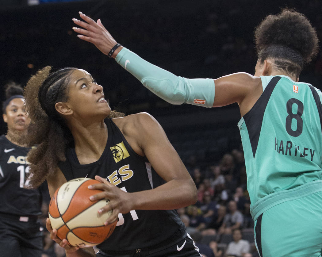 Aces guard Jaime Nared (31) drives past New York Liberty guard Bria Hartley (8) in the second q ...