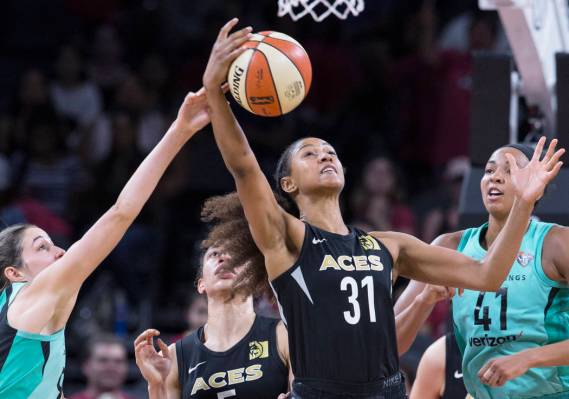 Aces guard Jaime Nared (31) fights for a loose ball with New York Liberty defenders Kiah Stokes ...
