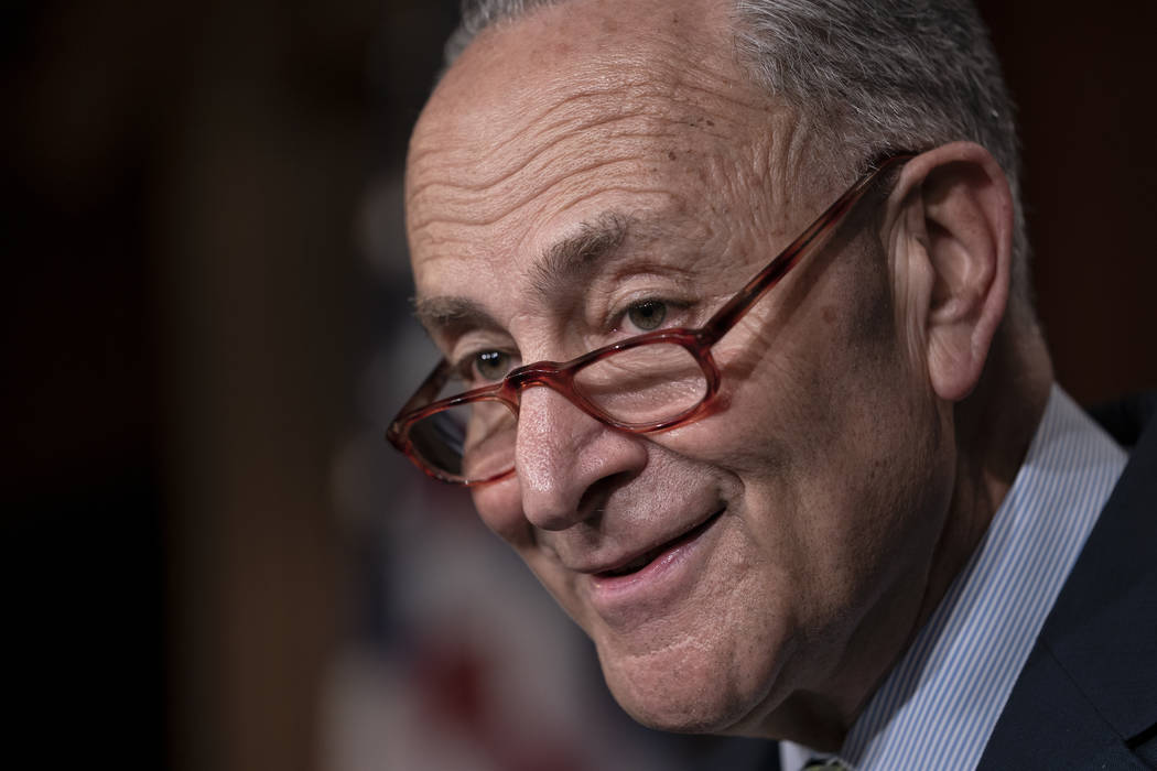 Senate Minority Leader Chuck Schumer, D-N.Y., talks to reporters after the Senate passed a $19 ...