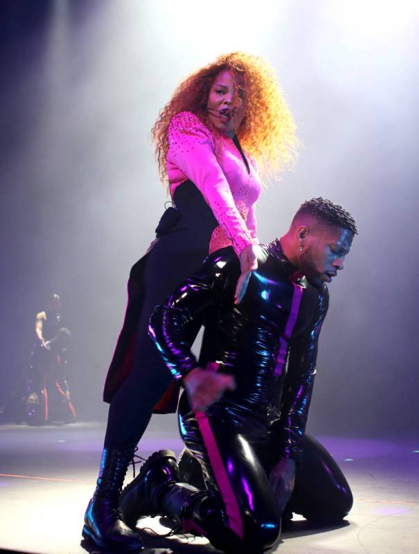 Janet Jackson (L) performs onstage during the opening night of her Metamorphosis - The Las Vega ...