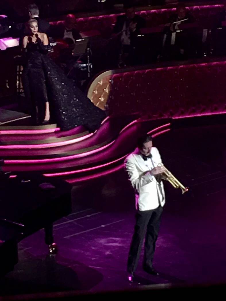 Lady Gaga sings behind the trumpet artistry of Brian Newman during her appearance at Encore Th ...