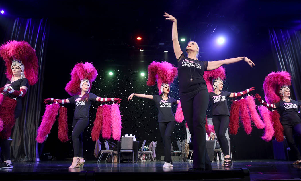 Co-creator Stacy Law-Blind, foreground, teaches the showgirl walk to, from left, Jacqueline Hil ...