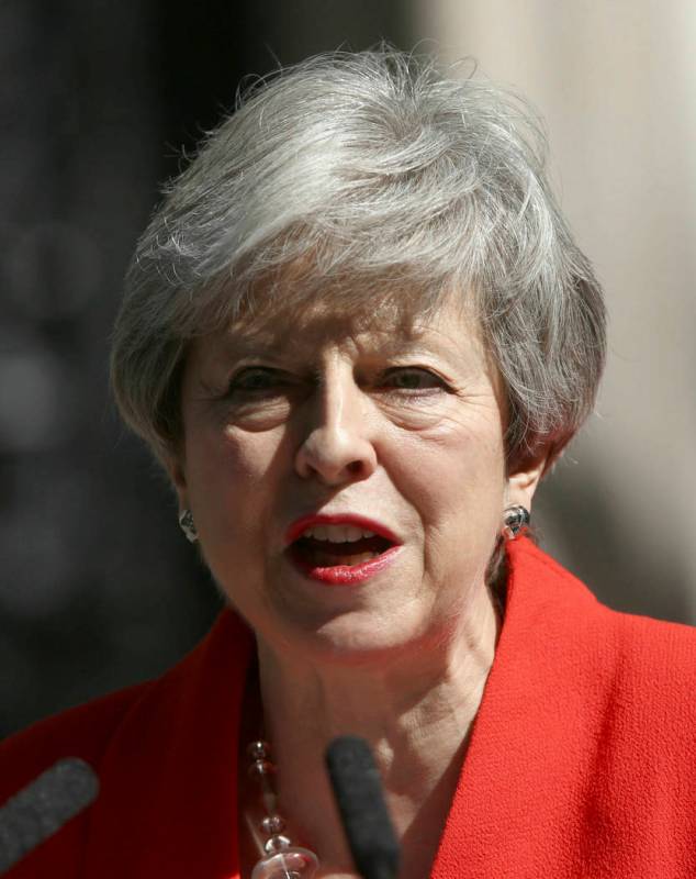 Britain's Prime Minister Theresa May makes a statement outside at 10 Downing Street in London, ...