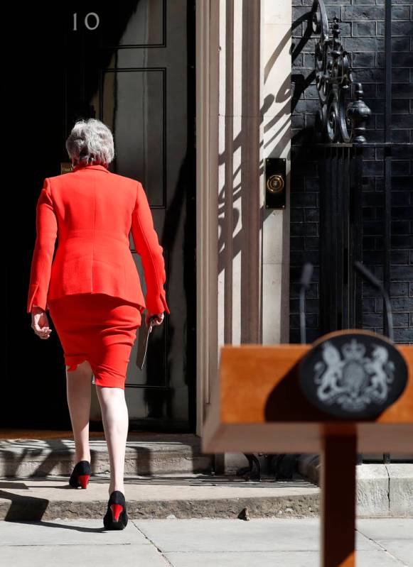 British Prime Minister Theresa May walks away after making a speech in the street outside 10 Do ...