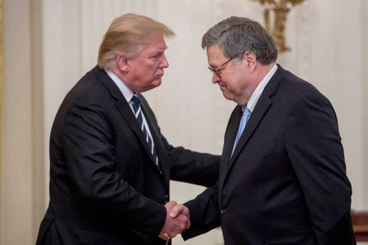 President Donald Trump and Attorney General William Barr shake hands during a Public Safety Off ...