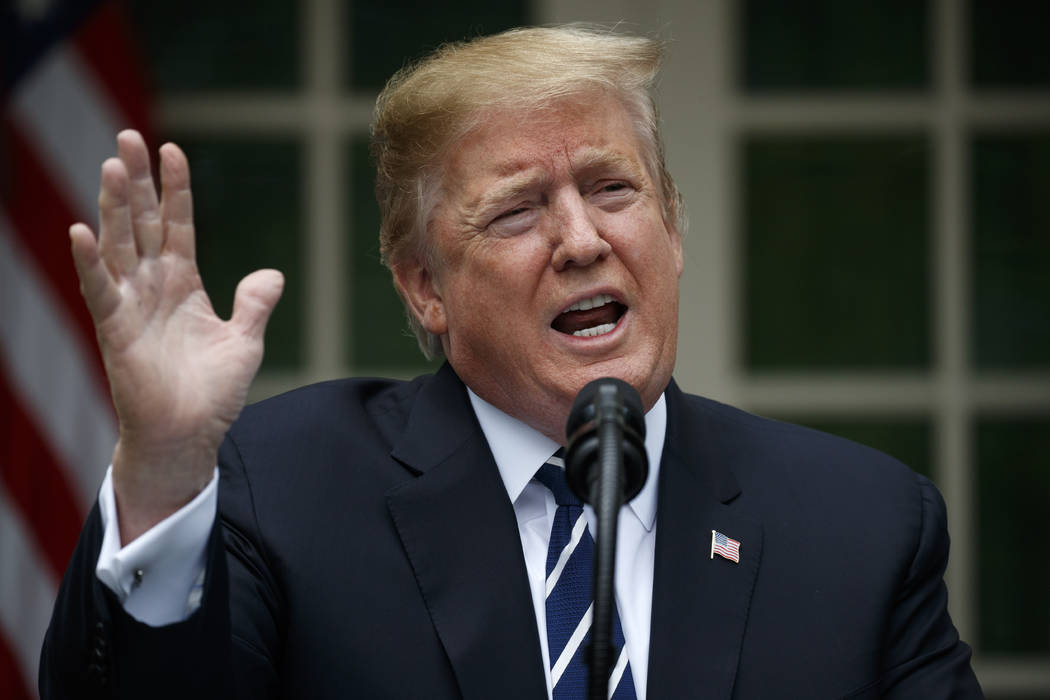 President Donald Trump delivers a statement in the Rose Garden of the White House, Wednesday, M ...