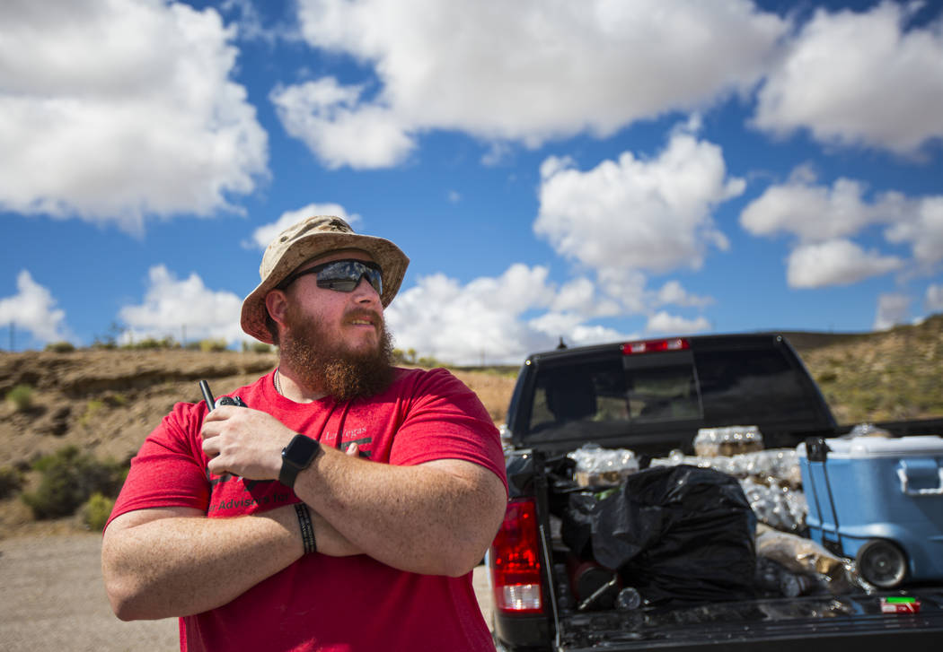Sean Brown, president of UNLV Rebel Vets, looks on from a stop during a ruck march Friday, May ...