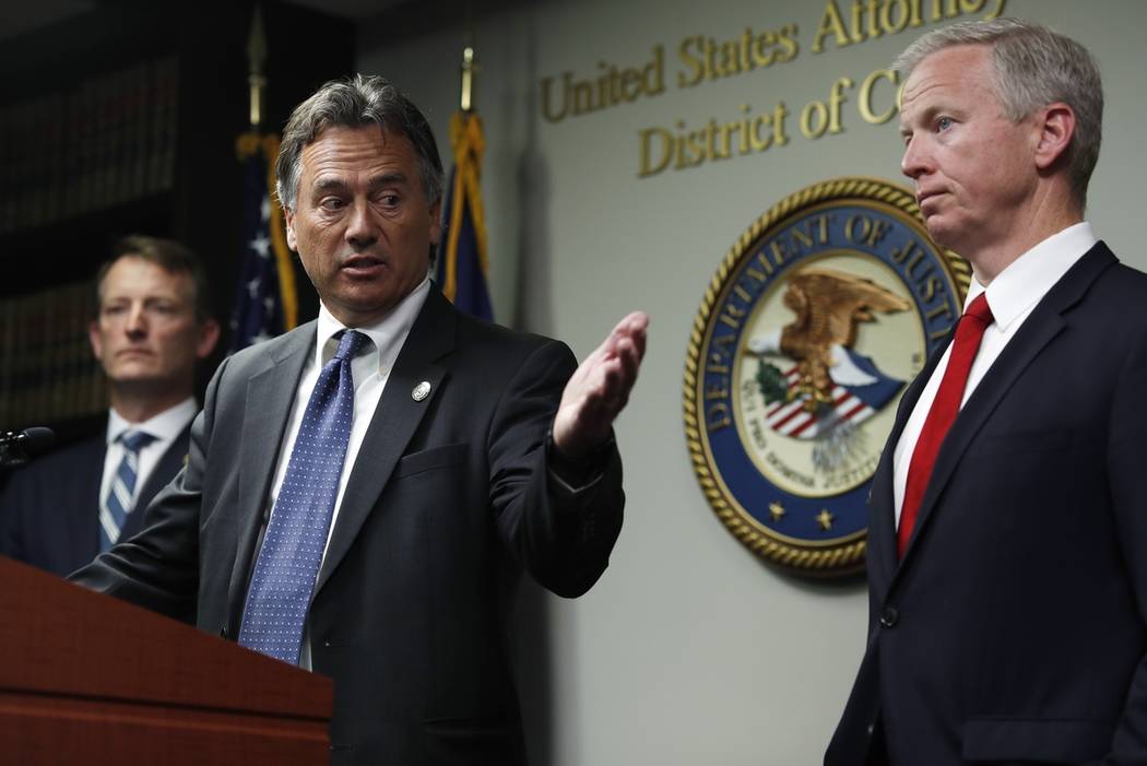 Dave Young, 17th Judicial District Attorney, front left, makes a point as George Brauchler, 18t ...