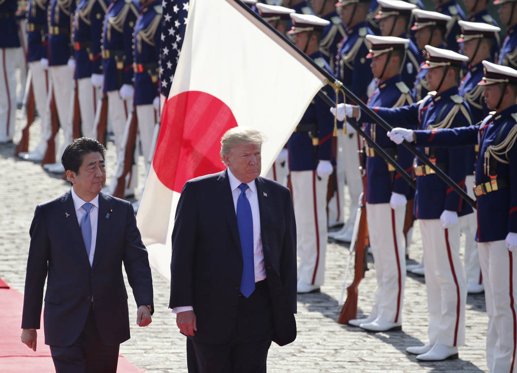 FILE - In this Nov. 6, 2017, file photo, U.S. President Donald Trump, second from left, reviews ...