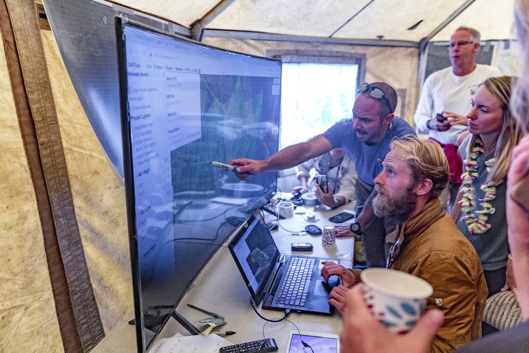 Rescue leads Javier Cantellops, top, and Chris Berquist show some of the technology used for th ...