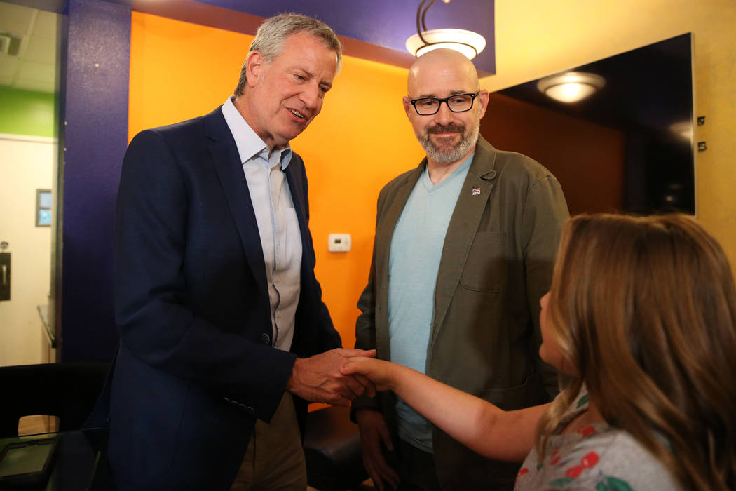 New York Mayor Bill de Blasio, from left, a Democratic presidential candidate, meets Brian Shep ...