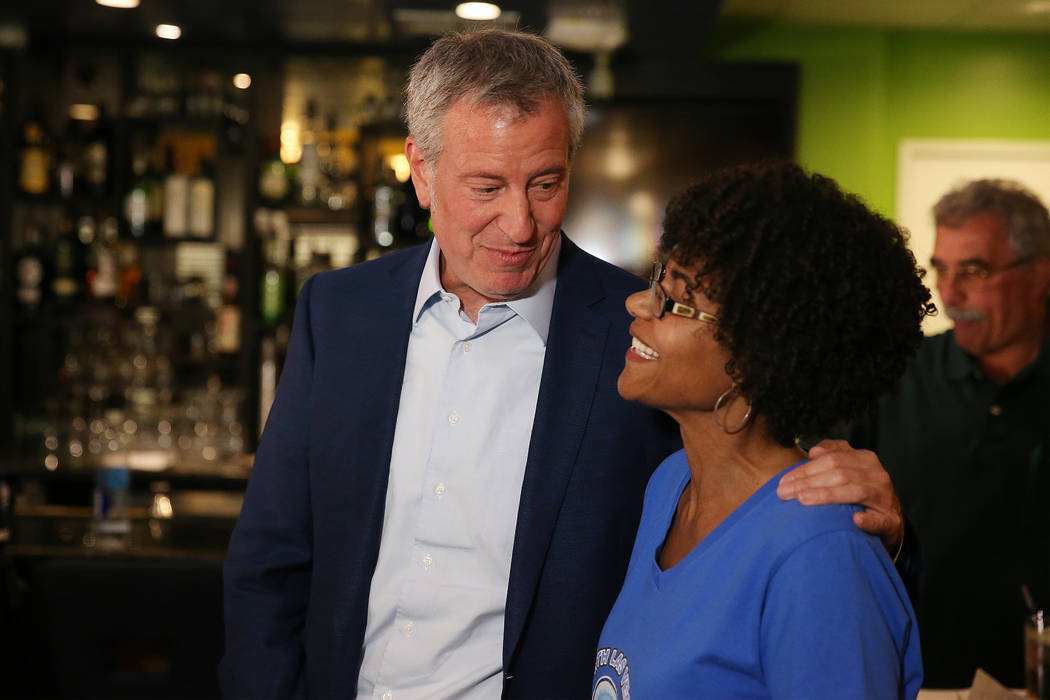 New York Mayor Bill de Blasio, left, a Democratic presidential candidate, meets Leilani Hinyard ...