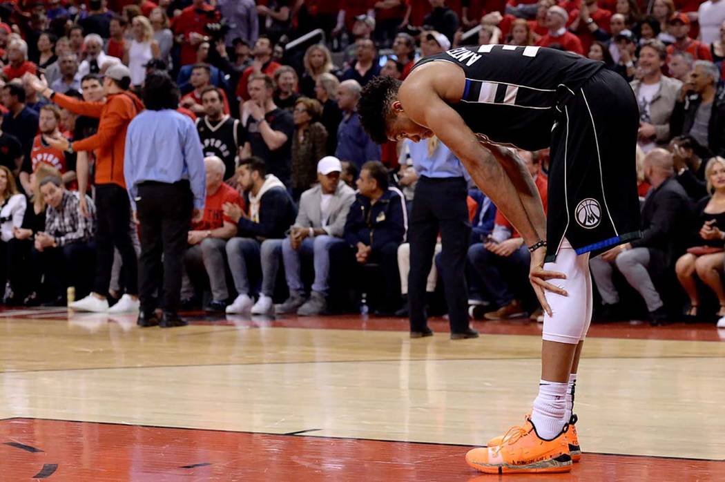 Milwaukee Bucks forward Giannis Antetokounmpo takes a moment on the court in the the closing mi ...