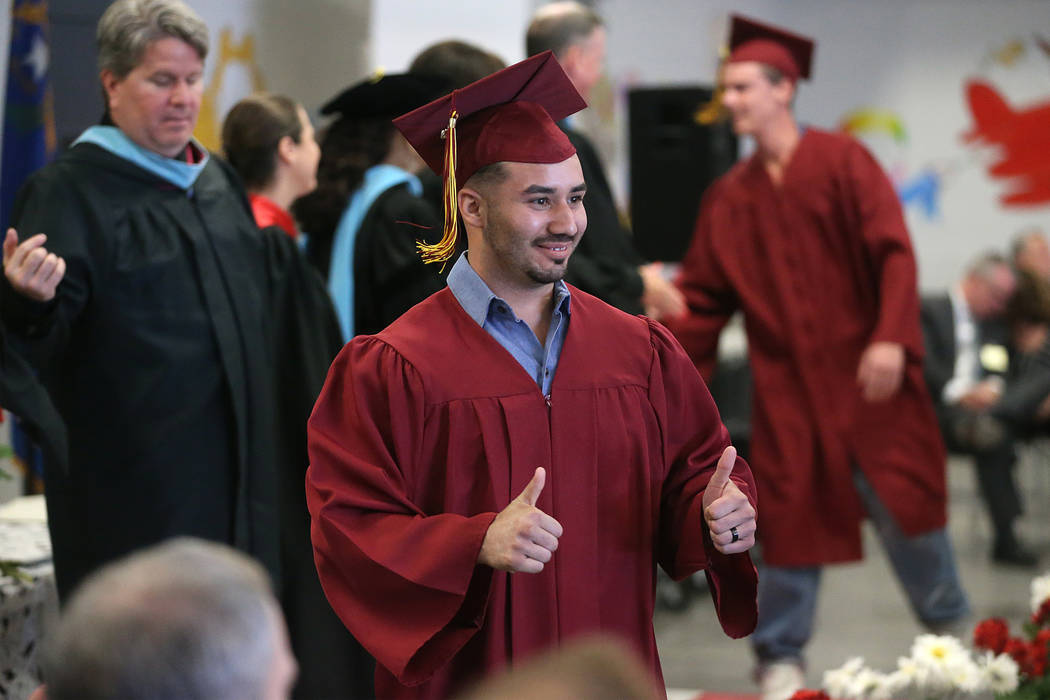 Inmate Gabriel Del Valle, 28, gestures as he graduates with a high school diploma, and certific ...