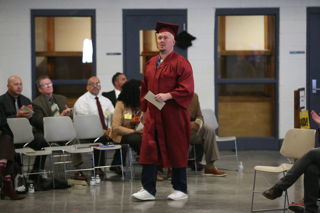Inmate Jeremiah Valentine walks to be recognized during his graduation from the Adult High Scho ...