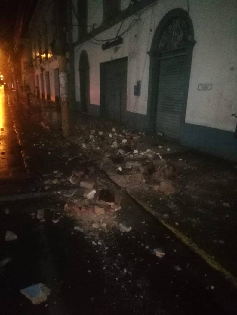 In this photo provided by Firefighters of Peru, debris covers a street after an earthquake in Y ...