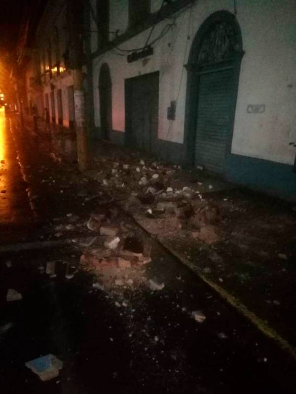 In this photo provided by Firefighters of Peru, debris covers a street after an earthquake in Y ...