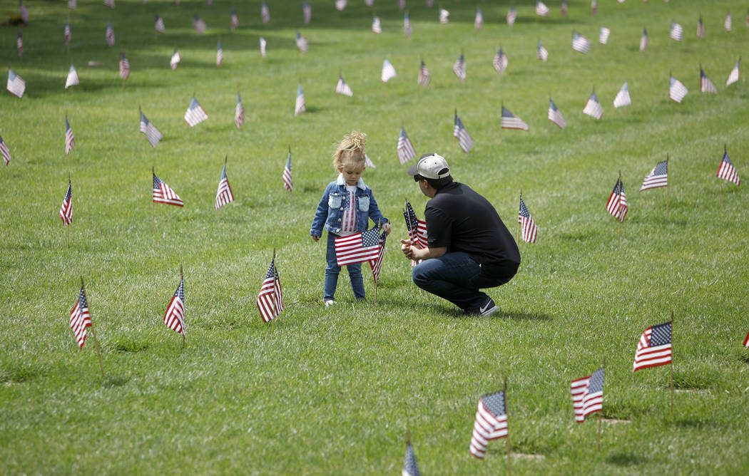 Liyah Makarechian, 3, sits with her dad Paul Makarechian at the Southern Nevada Veterans Memori ...