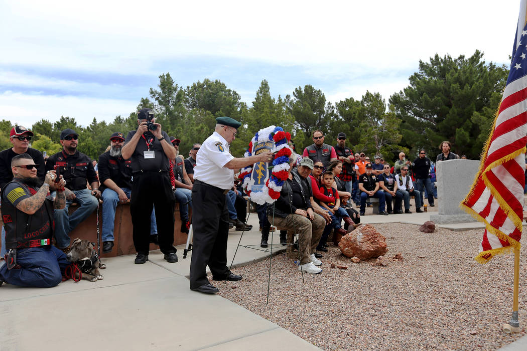 Member of the Special Forces Association Frank Flores places a wreath on a stand during a cerem ...