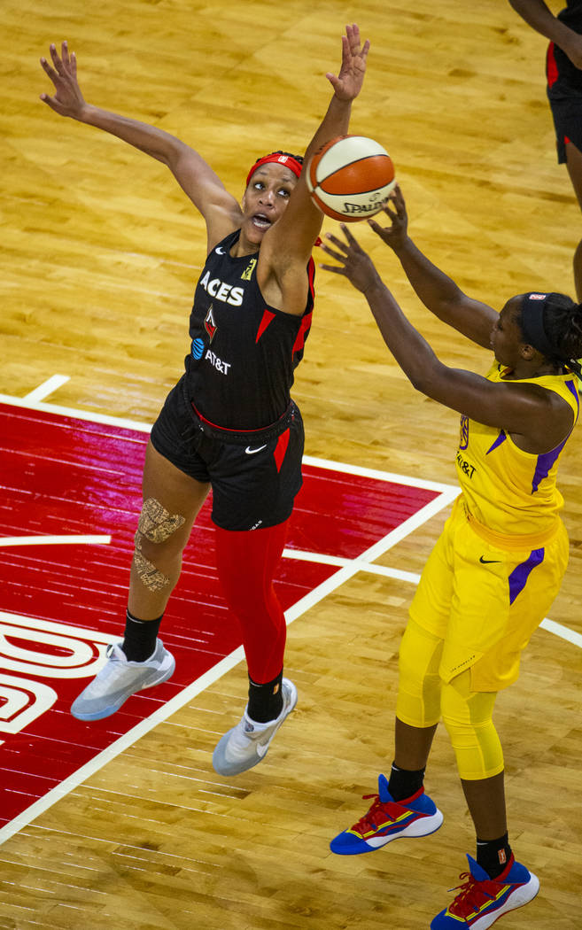 Las Vegas Aces center A'ja Wilson (22) rejects a shot by Los Angeles Sparks guard Chelsea Gray ...