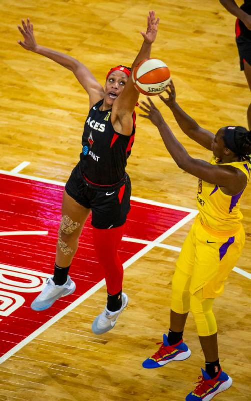 Las Vegas Aces center A'ja Wilson (22) rejects a shot by Los Angeles Sparks guard Chelsea Gray ...