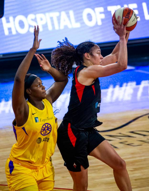 Los Angeles Sparks center Kalani Brown (21) defends the basket from Las Vegas Aces forward Dear ...